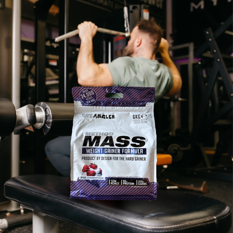 Bodybuilder in gym with Out Angled Method Mass Gainer Strawberry